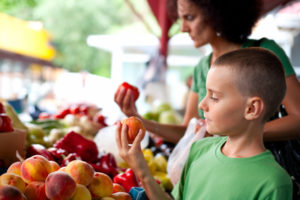 Boy and mom at the farmers market