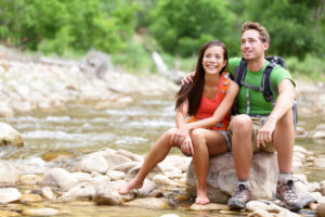 Couple hiking near a stream