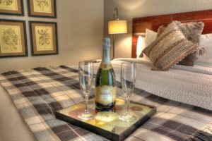 champagne bottle and two flute glasses